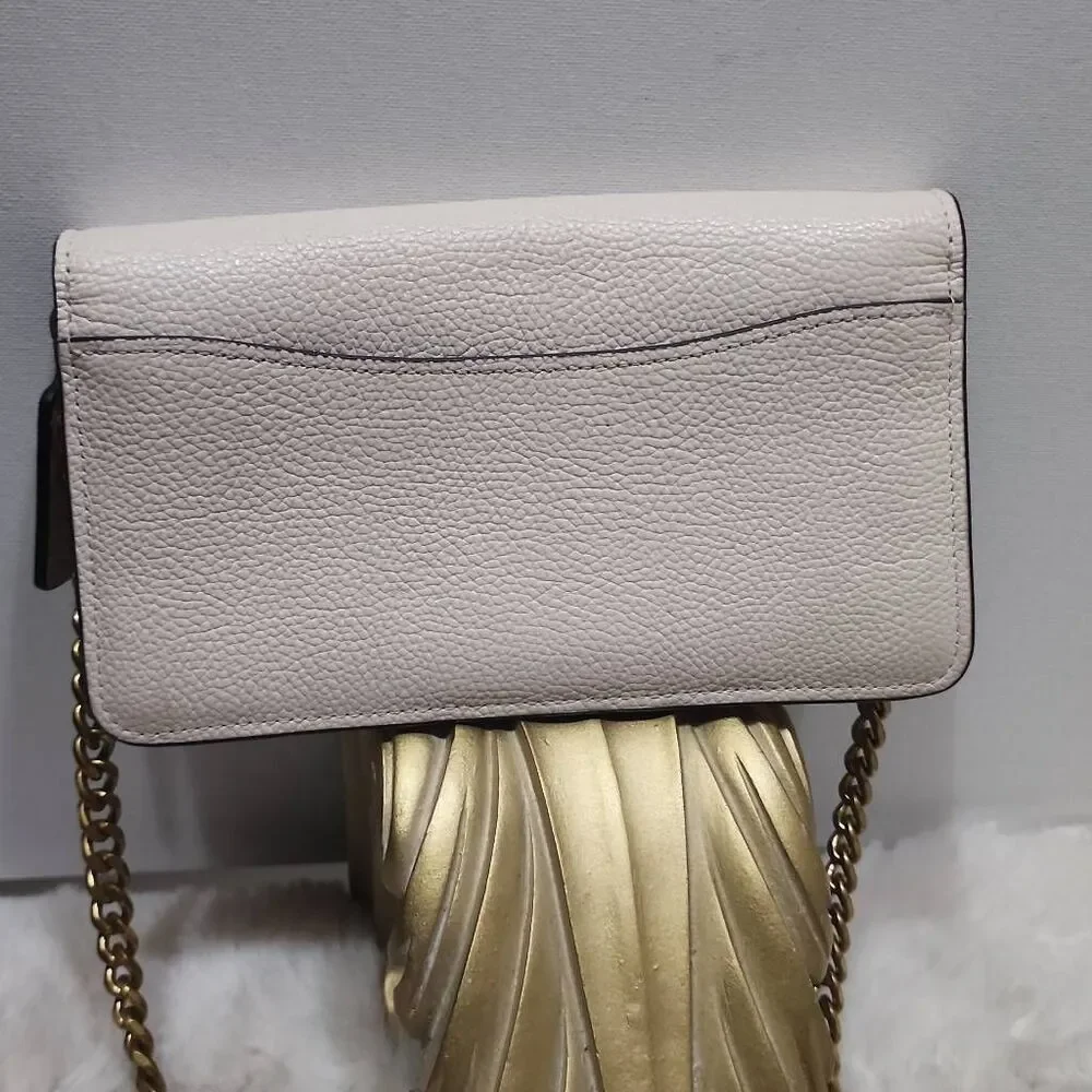 Coach Tabby Mini Chain Clutch in Chalk pebbled leather with gold-tone upgraded c
